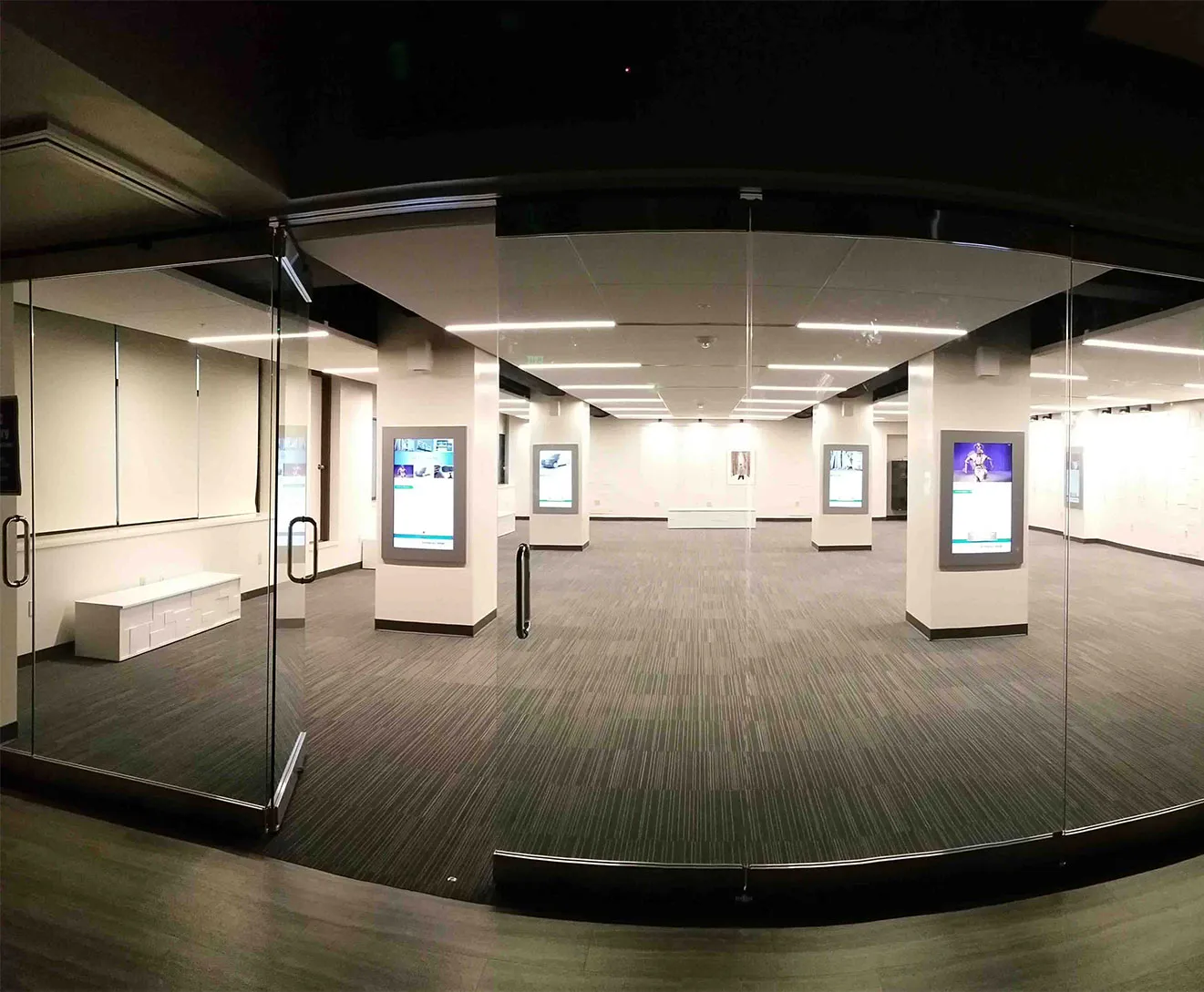 A room of installed interactive kiosks